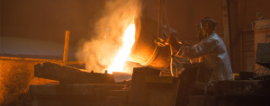 Ladle - Eagle Alloy operators pouring molten steel from a ladle into a mold