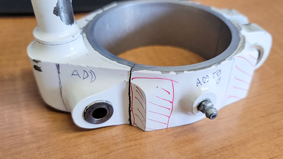 Original Temco part with surface areas identified for removal and reinforcement